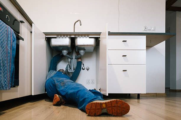Professional Drain Cleaning technician working in Williamsville, IL